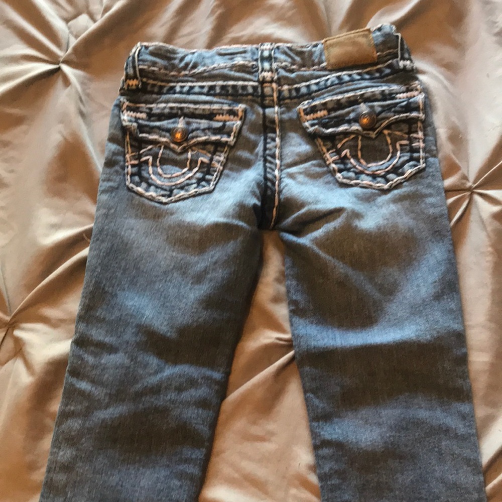 Girls True Religion jeans.